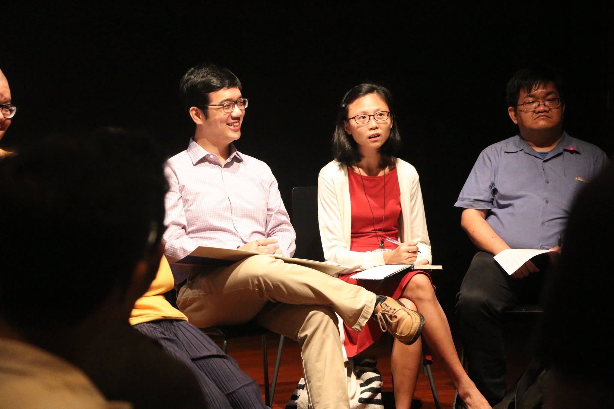 Citizen Reviewers Isaac Tan and Jocelyn Chng sit amongst attendees.