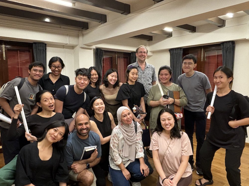 A large group photo of smiling people.