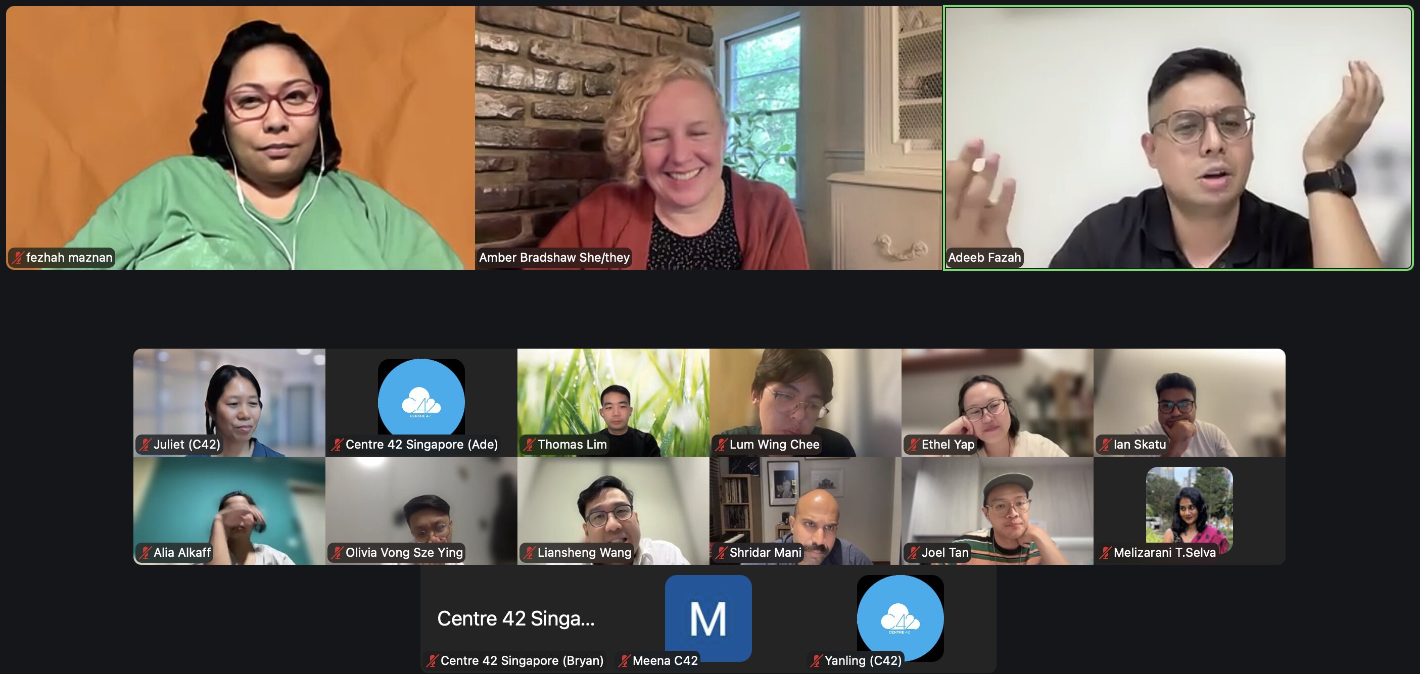 A Zoom session featuring three main speakers and a gallery of participants.